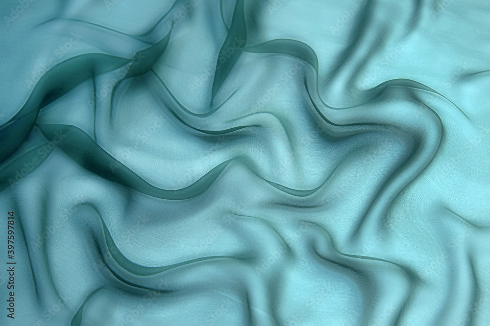 Wall mural Tidewater Green color organza fabric background. Beautiful abstract wavy fabric pattern.