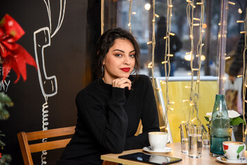 Beautiful young girl and New Year's decoration