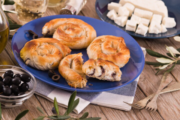 Pastry swirls with cheese and olive filling.
