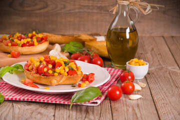 Friselle with tomatoes and mais.
