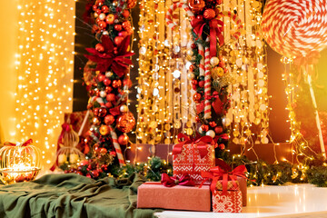 Beautiful Christmas red gift boxes on background bokeh blur lights and illumination