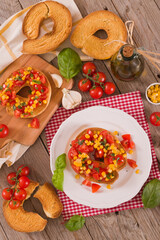 Friselle with tomatoes and mais.
