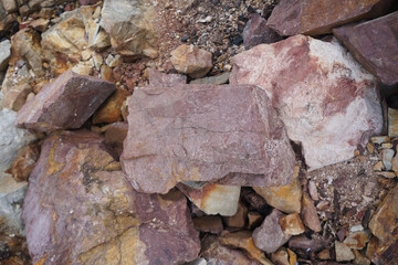 Piece of Pink Arkose Sandstone rock on nature background.  Sandstones are sedimentary rocks. 
