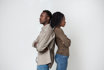 Frustrated african american couple posing on grey