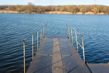 Obraz premium metal pier on the river