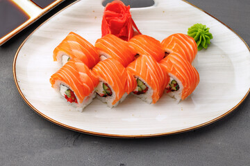Philadelphia sushi roll on plate close up