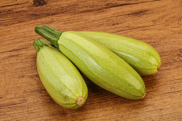 Young tasty zucchini over board