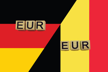 Germany and Belgium currencies codes on national flags background
