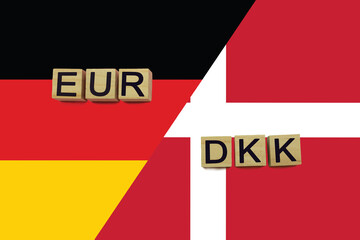 Germany and Denmark currencies codes on national flags background