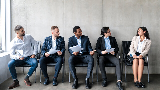 Businessmen Staring At Lady Applicant Waiting For Job Interview Indoor
