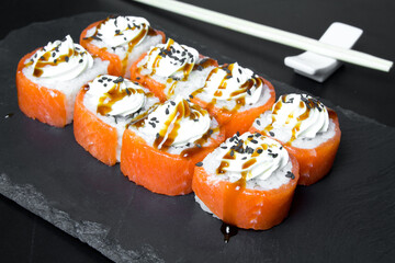 Sushi rolls Philadelphia with salmon and topped with cream cheese