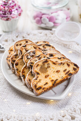 Traditional Christmas stollen with icing sugar. Christmas Cake. German Christmas bread
