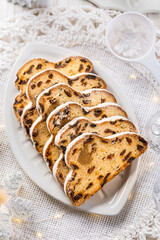 Traditional Christmas stollen with icing sugar. Christmas Cake. German Christmas bread