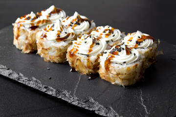 Sushi rolls Bonito and topped with cream cheese