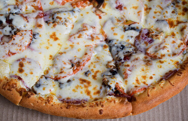 Slice of pizza in a cardboard box.