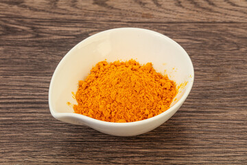 Tumeric powder in the bowl