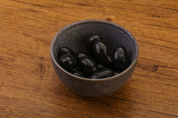 Pickled black olives in the bowl