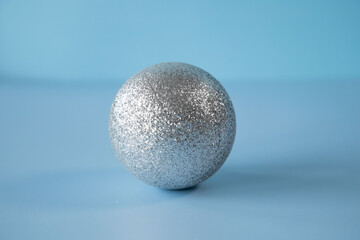 Christmas pine balls on blue background.