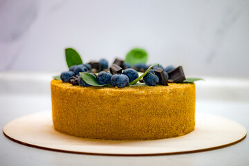 Honey cake with blueberries and mint