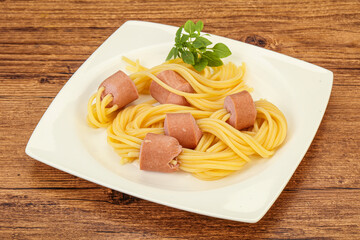Kids pasta spaghetti with sausages