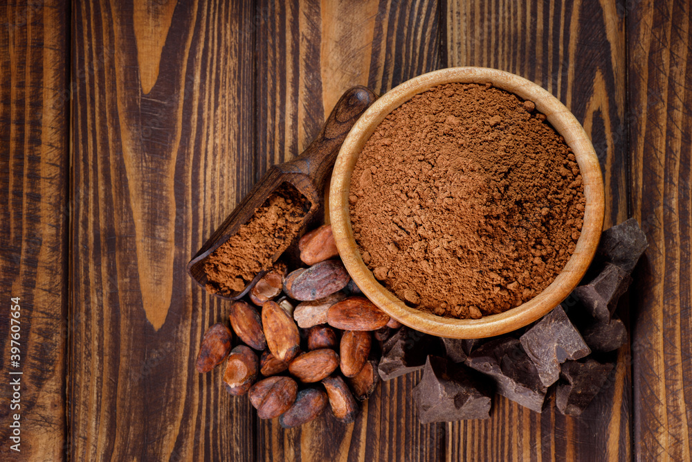 Wall mural cacao powder in wooden bowl