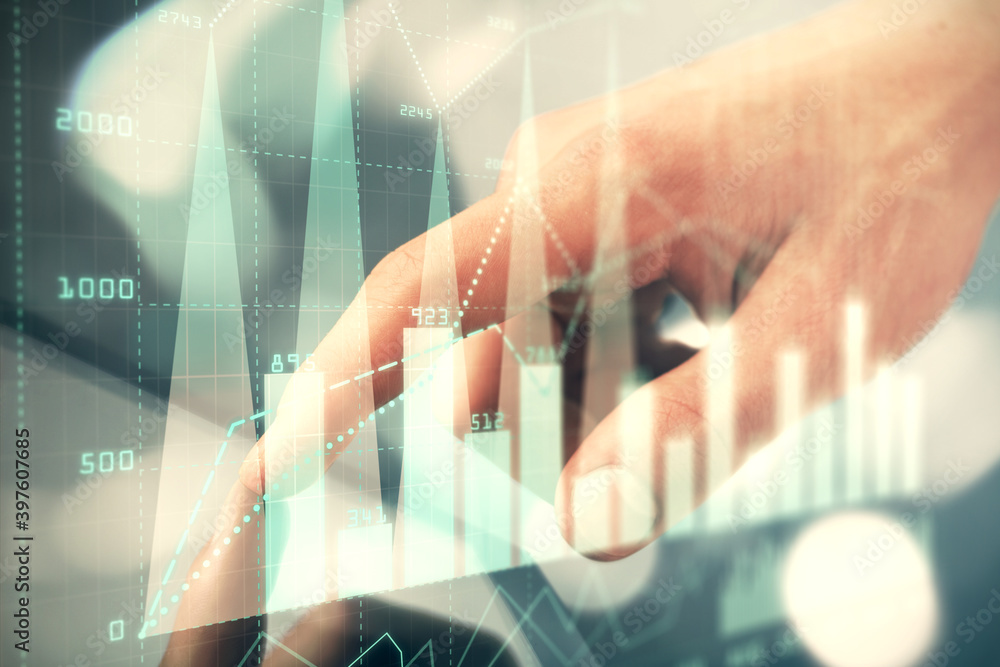 Poster multi exposure of man's hands holding and using a phone and financial chart drawing. market analysis