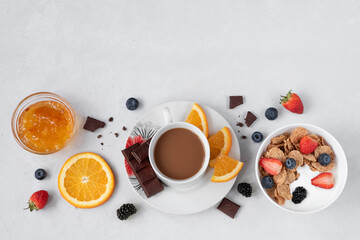 Fruit layout with yogurt and coffee on a white background