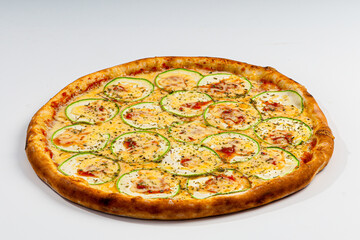 Mozzarella pizza with zucchini and oregano on white background.