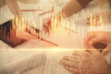 Double exposure of forex graph drawing and man and woman working together holding and using a mobile device. Trade concept.