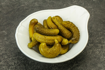 Pickled gherkin in the bowl