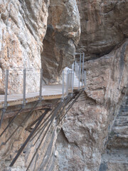 The Caminito del Rey is a pass built into the walls of the Gaitanes Gorge, Malaga. It is a pedestrian footbridge of more than three kilometers . with sections of a width of just one meter, hanging up 