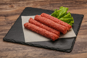 Raw beef sausages with spices