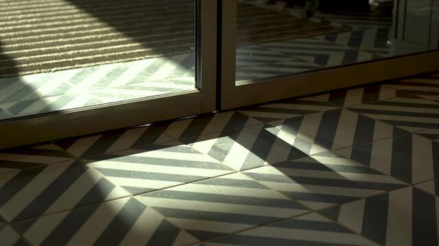 Automatic non-contact doors open and close. Close-up. Daylight sunlight.