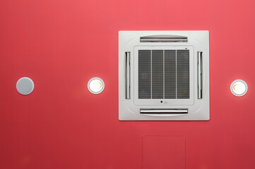 Ceiling Air Conditioner on red ceiling light and loudspeaker