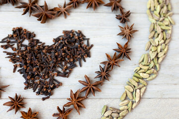 Hearts made of from spices on a beige background. Valentines day card. Symbol of love.