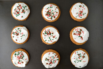 high angle view christmas gingerbread sugar cookies on baking tray