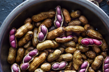 Close up of boiled peanuts or groundnuts, macro shot of peanuts in a steel bowl. agriculture, farming, sustainable, crop, gardening, supplies concepts.