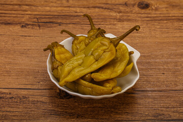 Marinated spicy and hot green pepper