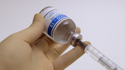 Corona Covid-19 vaccine - filling the injection - photo