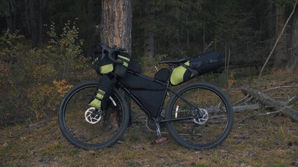The mixed terrain cycle touring bike with bikepacking. The travel journey with light bicycle bags...