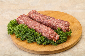 Raw minced beef kebab skewer