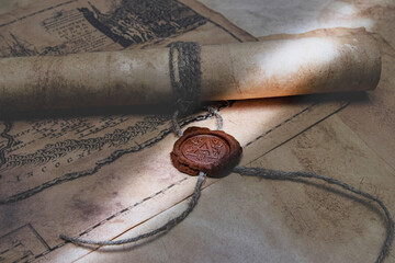 An old paper scroll sealed with a wax seal. The manuscript is rolled up and sealed.