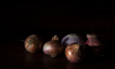 onions on dark background