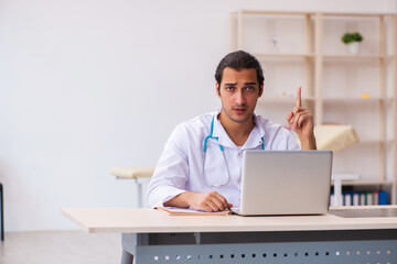 Young male doctor in telemedicine concept