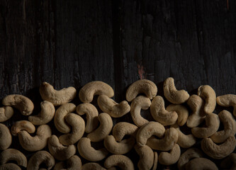cashew nuts on dark wooden table