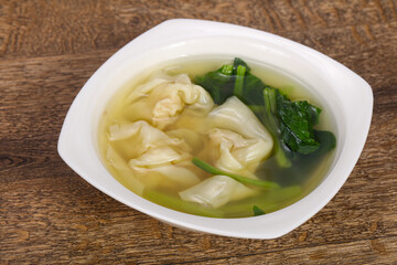 Asian traditional Wonton soup with herbs