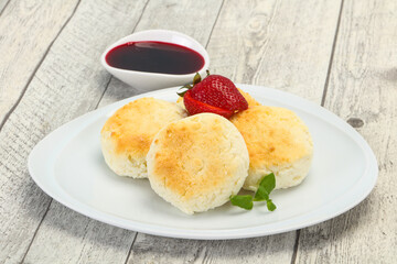 Curd pancakes with jam and stravberry