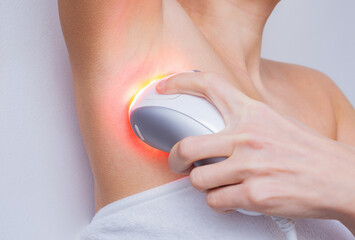 Intense pulsed light or laser armpit depilation and unwanted hair removal. Spa treatments at home,...