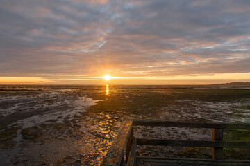 Obraz premium Sunrise over the wadden sea in Amrum, Germany