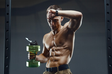 man drinking water after fitness workout